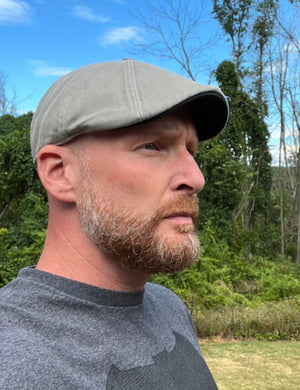 Man Wearing a Boston Scally Cap Outdoors