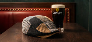 The Guinness Gilroy Cap in front of a Pint of Guinness