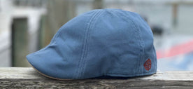 The Blue Sailor Cap on a Wood Background