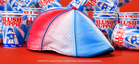 The Slush Puppie Cap in front of multiple Slush Puppie cups