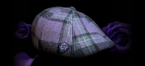 The Violet Rose cap featuring a Purple and Black plaid against a black background with purple roses