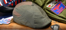 Top Gun Scally cap on wooden background